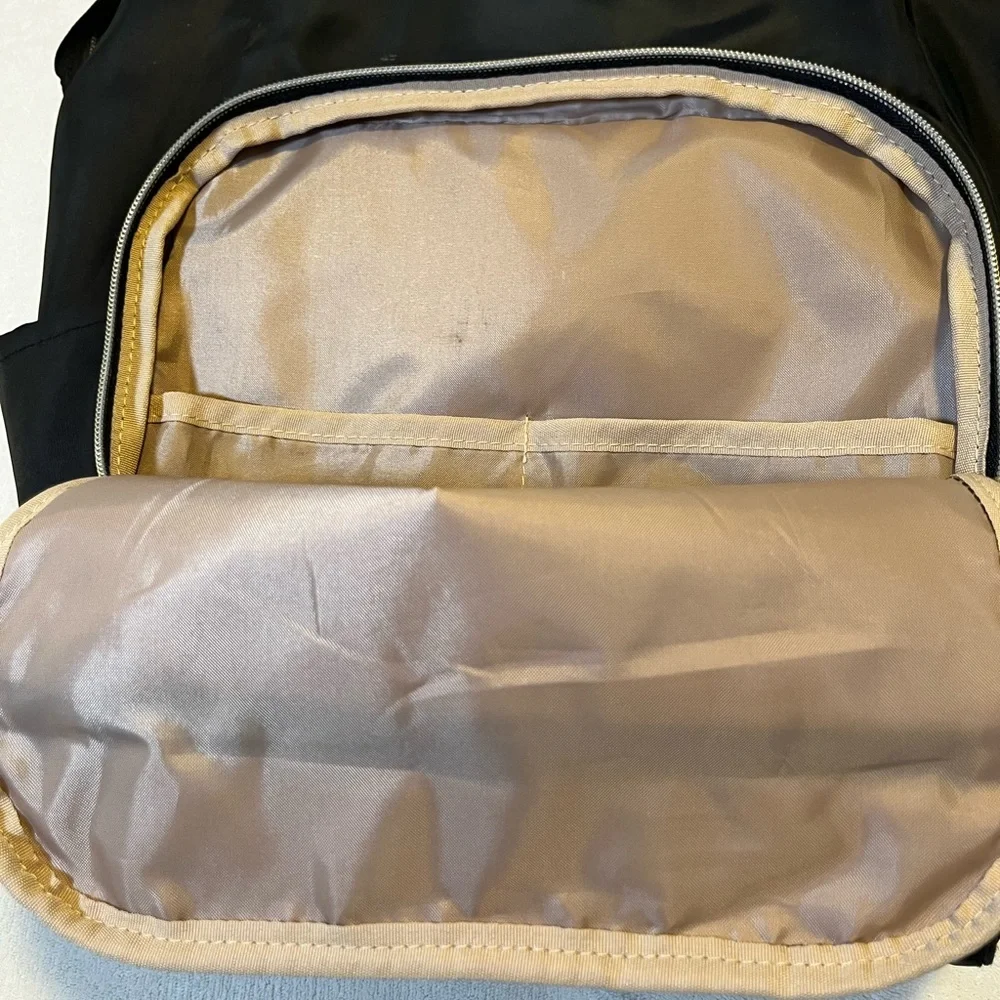 Black Quilted Travel Backpack with Gold Trim